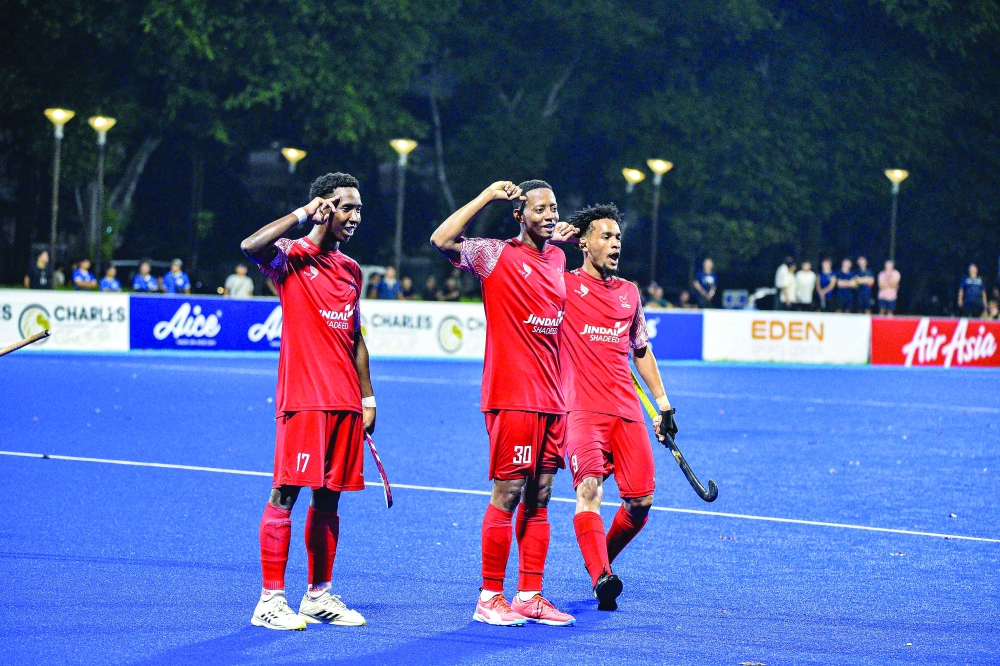 Oman players celebrate a goal in the final.