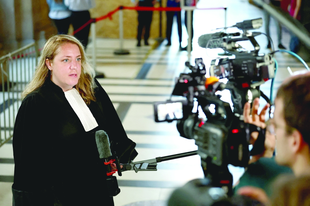Chloe Arnoux, one of the lawyers of Aomar Ait Khedache, talks to journalists during a break on the first day of the trial of Aomar Ait Khedache and 9 other people at the Court of Appeal of Paris. — Reuters