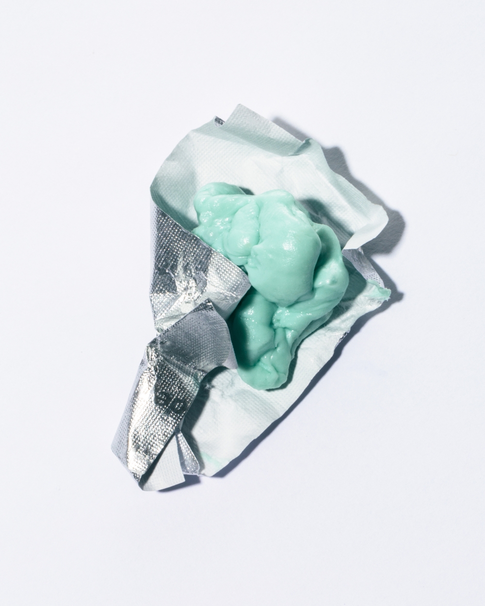 A piece of green chewed gum in New York,  April 16, 2025.  (Eric Helgas/The New York Times)