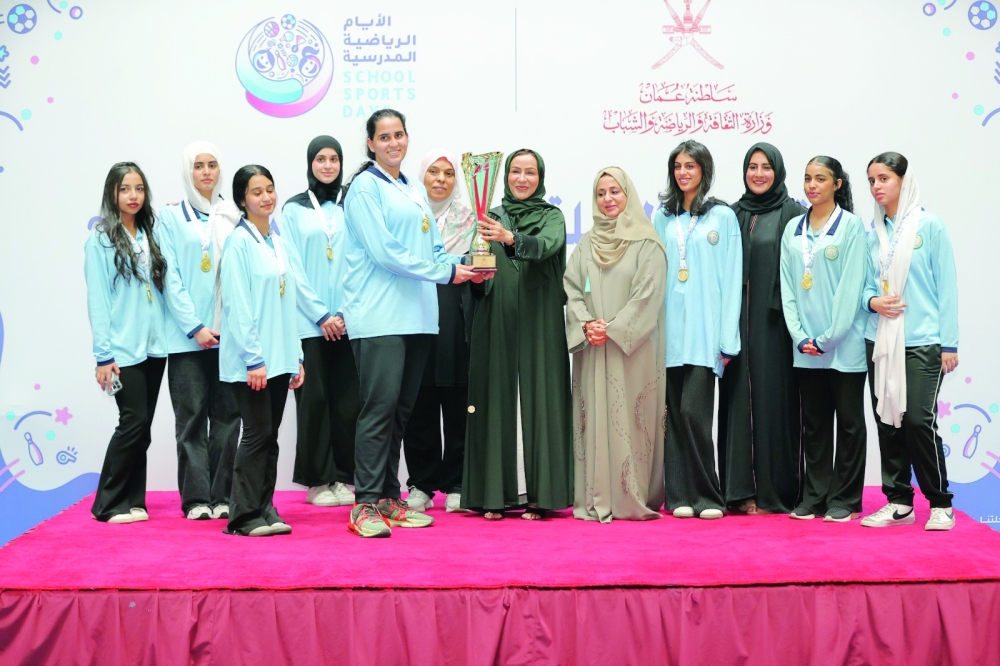 The National Private School captain receives the champions' trophy.