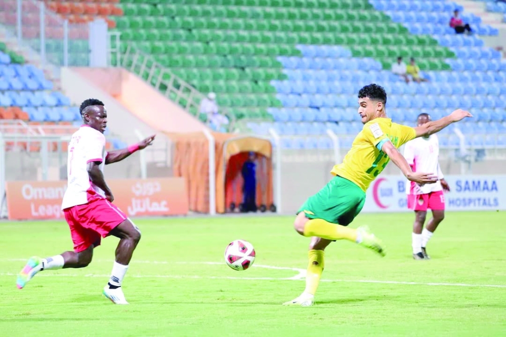 Seeb and Oman Club players fight for the ball.