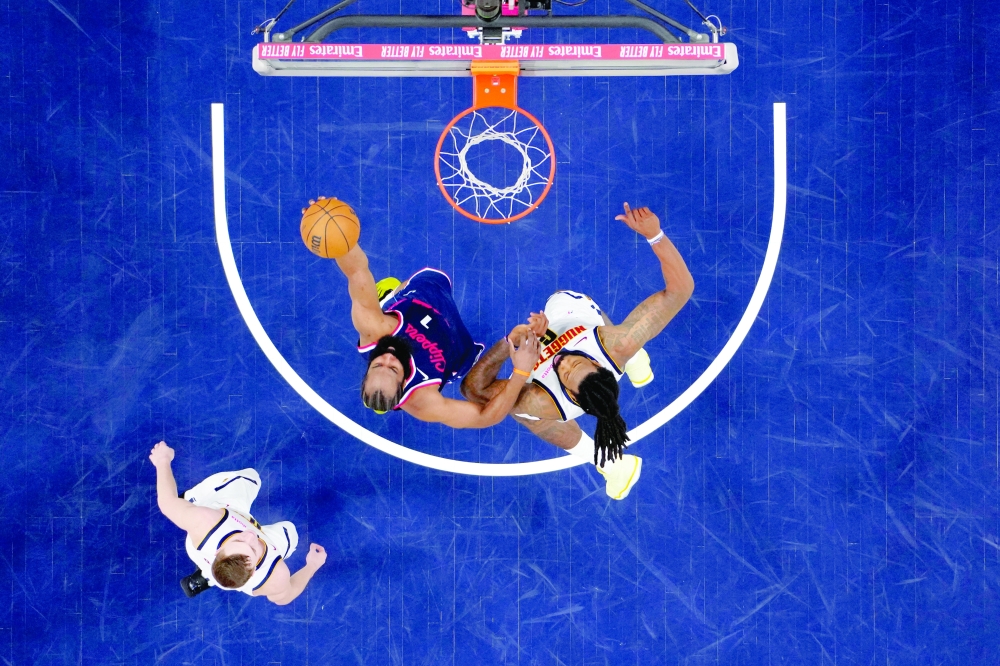 LA Clippers guard James Harden (1) shoots the ball against Denver Nuggets centre DeAndre Jordan (6) and guard Christian Braun (0) in the first half during game six of first round for the 2025 NBA Playoffs at Intuit Dome. — Imagn Images