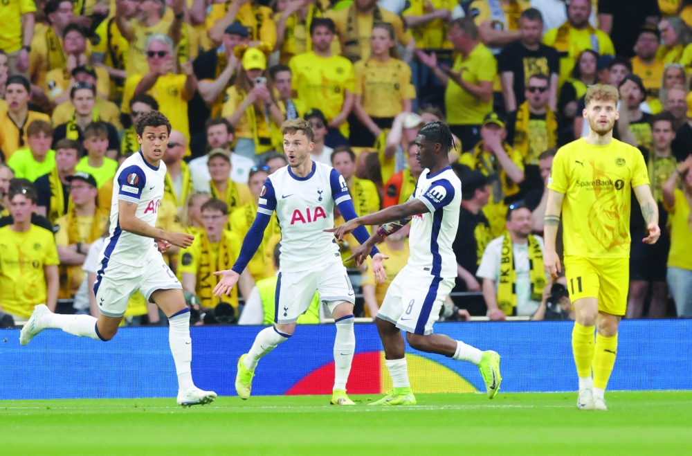 Tottenham Hotspur's Brennan Johnson celebrates scoring their first goal with James Maddison and Yves Bissouma. — Reuters