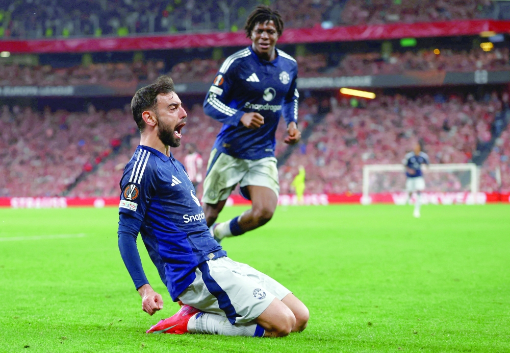 Manchester United's Bruno Fernandes celebrates scoring their third goal with Patrick Dorgu. — Reuters