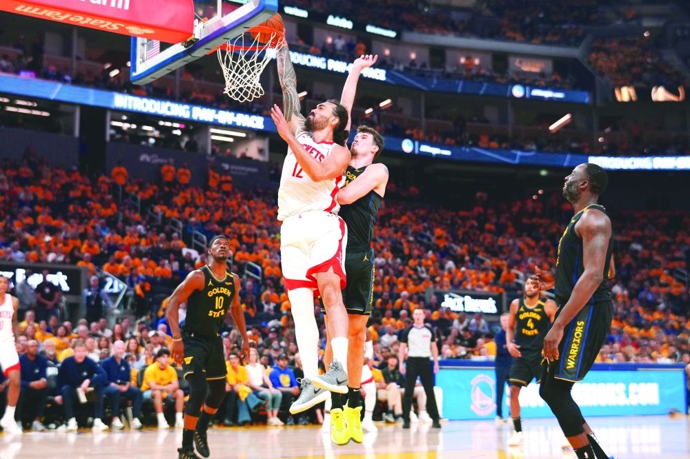 Houston Rockets centre Steven Adams (12) dunks the ball in front of Golden State Warriors centre Quinten Post (21) in the second quarter of game six of the first round for the 2025 NBA Playoffs at Chase Center. — Reuters