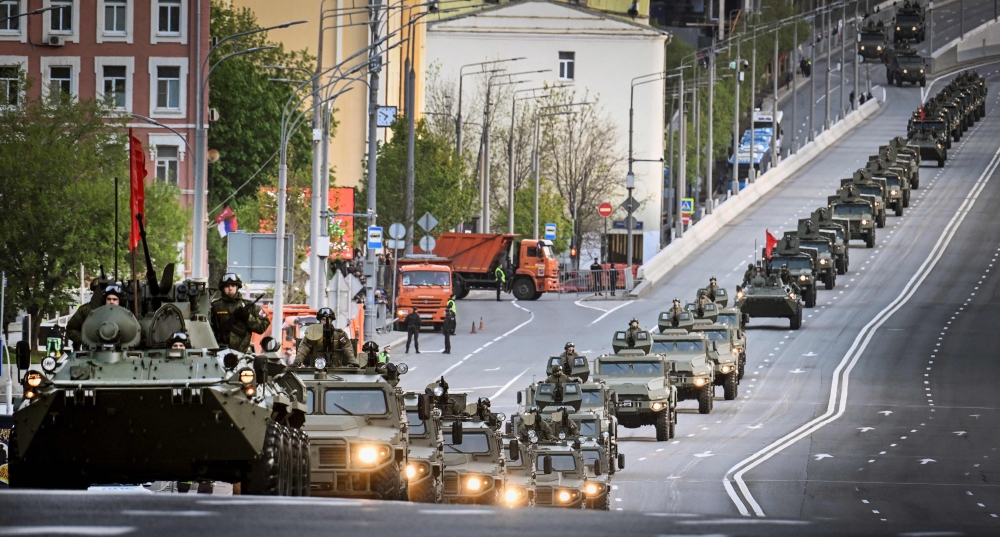 A Russian army convoy travels through central Moscow during a rehearsal for the Victory Day parade. — AFP