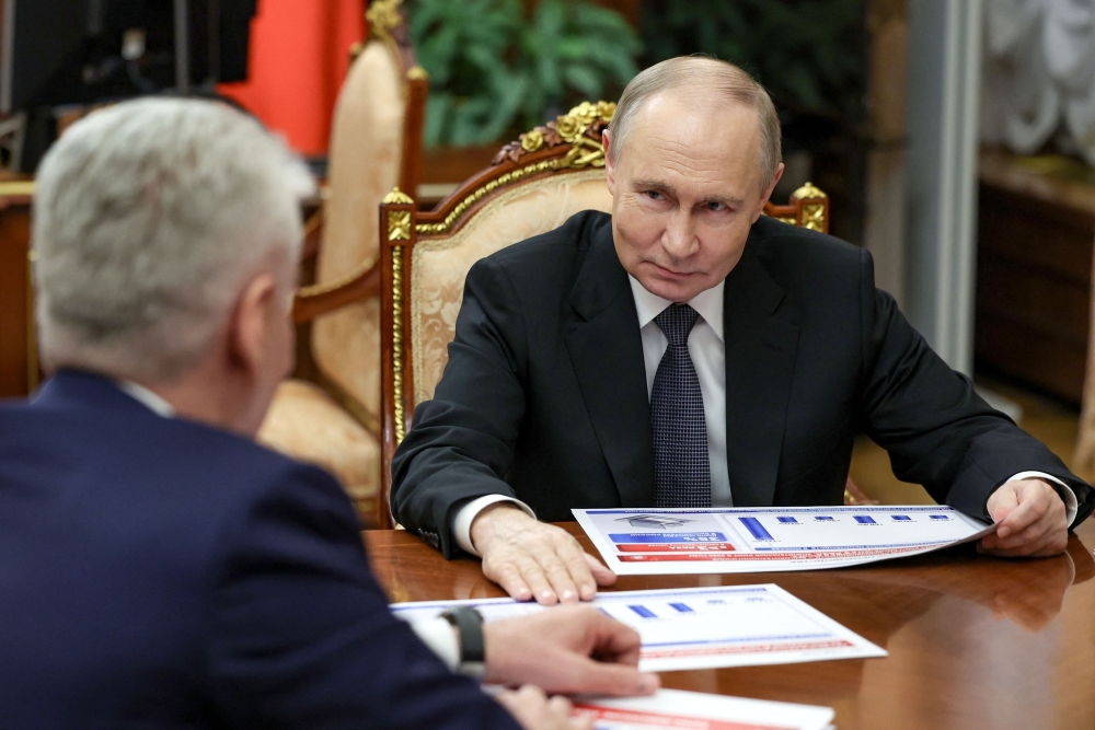 Russian President Vladimir Putin meets with Moscow Mayor Sergei Sobyanin at the Kremlin in Moscow on Monday. — AFP
