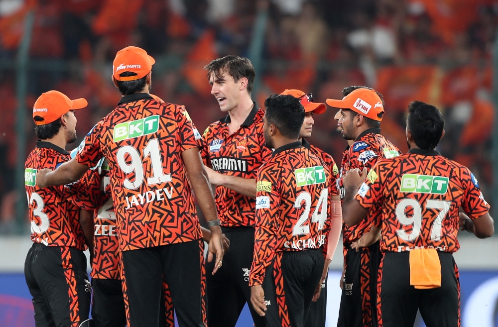 Cricket - Indian Premier League - IPL - Sunrisers Hyderabad v Delhi Capitals - Rajiv Gandhi International Cricket Stadium, Hyderabad, India - May 5, 2025 Sunrisers Hyderabad's Pat Cummins celebrates with teammates after taking the wicket of Delhi Capitals' Karun Nair REUTERS/Stringer
