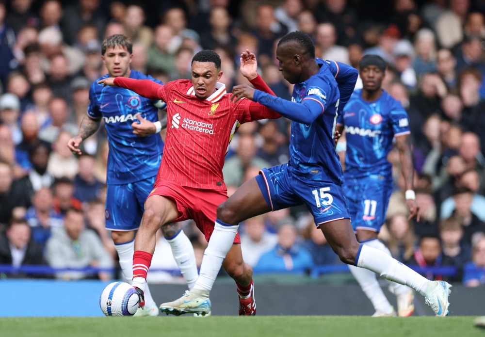 Chelsea's Nicolas Jackson in action with Liverpool's Trent Alexander-Arnold. — Reuters