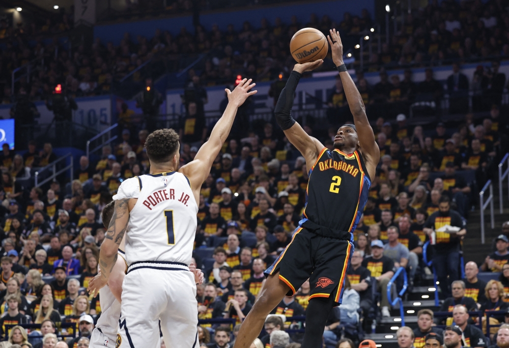 Oklahoma City Thunder guard Shai Gilgeous-Alexander (2) shoots against Denver Nuggets forward Michael Porter Jr. (1) during the second half in game one of the second round for the 2025 NBA Playoffs at Paycom Center. — Reuters