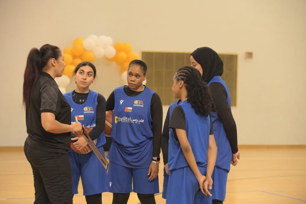 Head coach Wafa Zagdoudi with players during a training session.