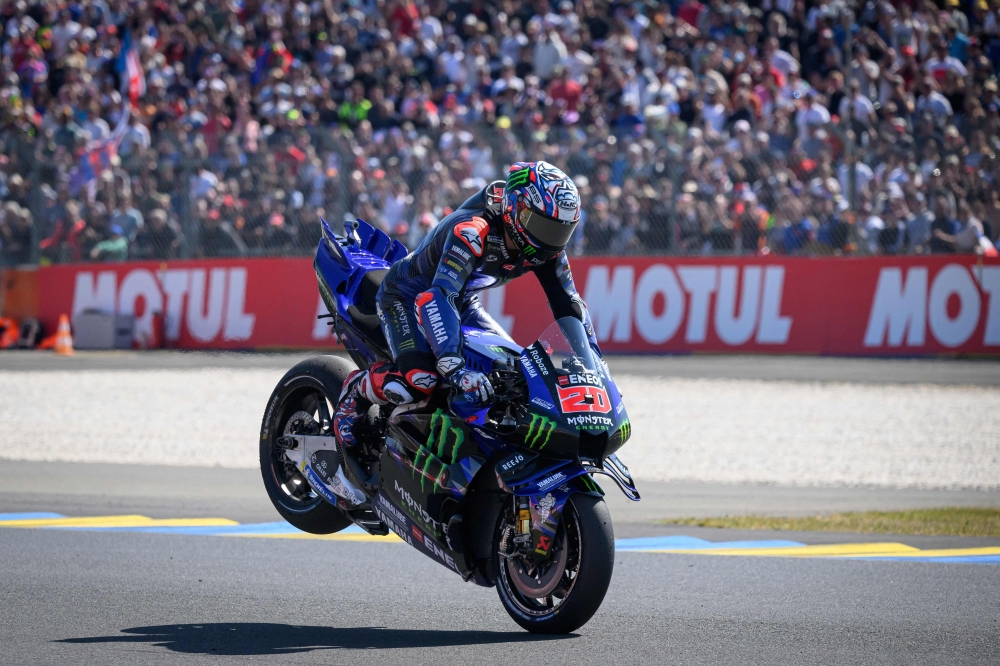 French MotoGP rider Fabio Quartararo celebrates after winning the Pole position during the France MotoGP Grand Prix qualifying session at the Le Mans Circuit. — AFP