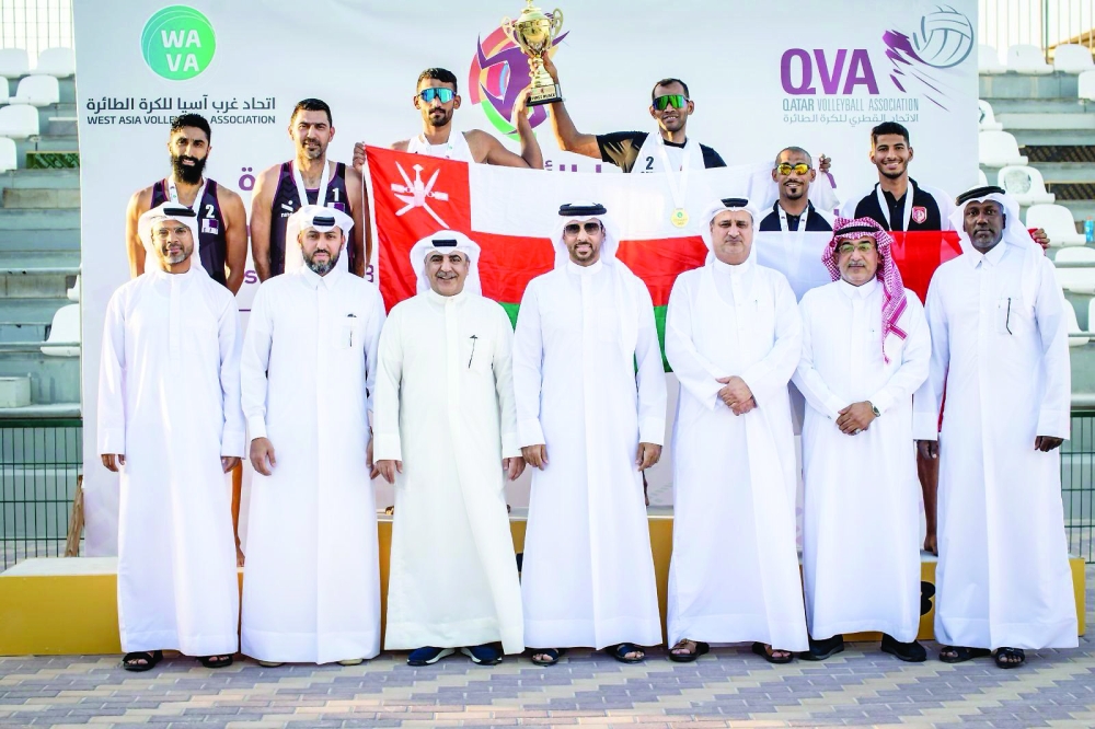 Oman players celebrate winning the West Asia Beach Volleyball title with the organising committee 