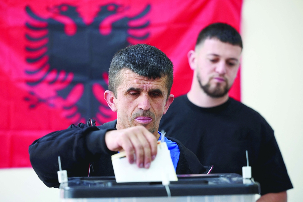 A man votes during parliamentary election in Tirana, Albania, on Sunday. — Reuters