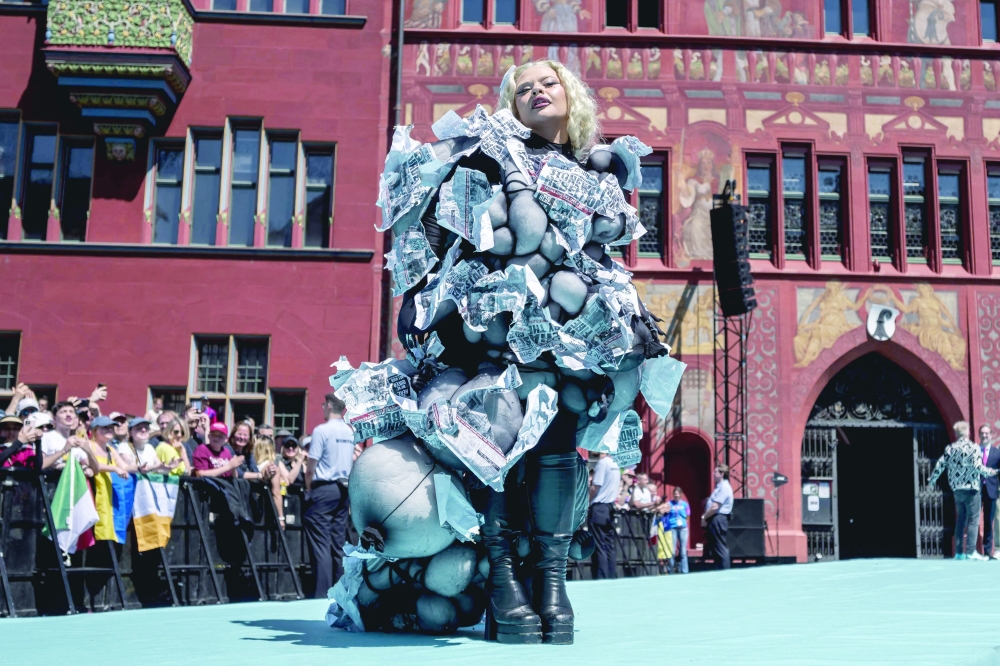 Maltese singer Miriana Conte representing Malta with the song "Serving" poses on the turquoise carpet next to the Basel Town Hall during the opening ceremony of the Eurovision Song Contest 2025 in Basel on May 11, 2025. 