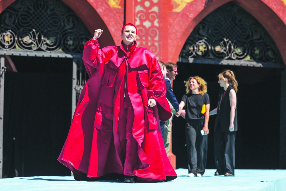 Belgian singer Red Sebastian representing Belgium with the song "Strobe Lights” arrives on the turquoise carpet next to the Basel Town Hall during the opening ceremony of the Eurovision Song Contest 2025 in Basel on May 11, 2025.