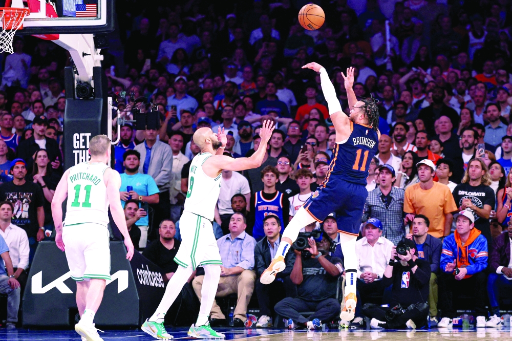 New York Knicks guard Jalen Brunson (11) makes a basket in front of Boston Celtics guard Derrick White (9) in the second half during game four of the second round for the 2025 NBA Playoffs at Madison Square Garden. — Reuters