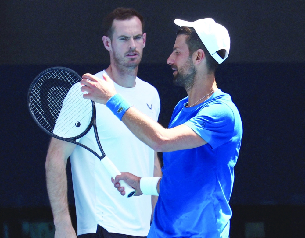Serbia's Novak Djokovic with coach Andy Murray during a practice session ahead of the Australian Open. — Reuters