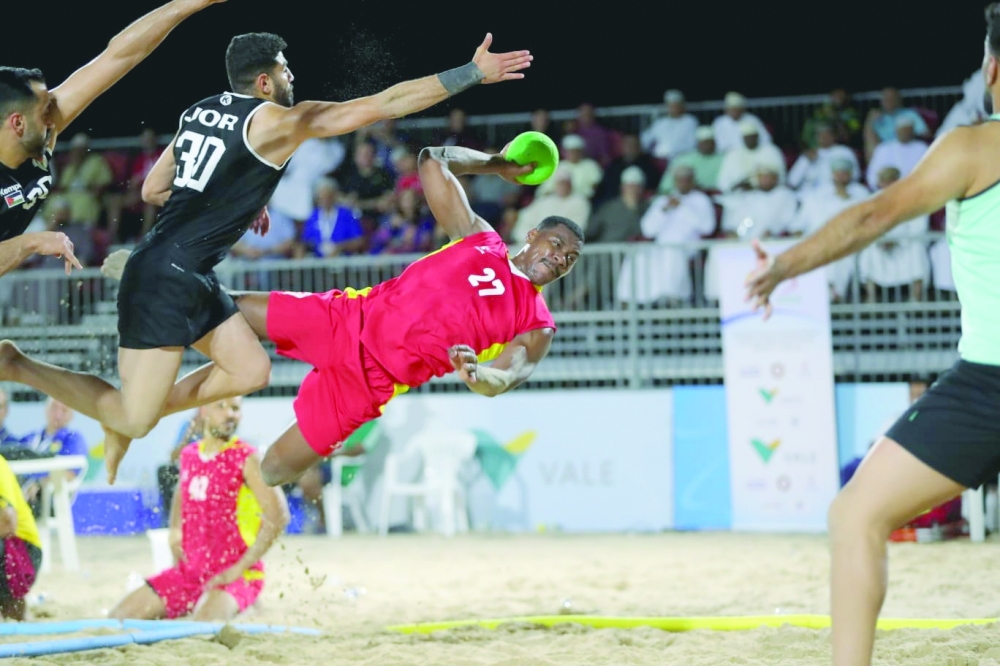 Oman player makes a goal attempt against Jordan.