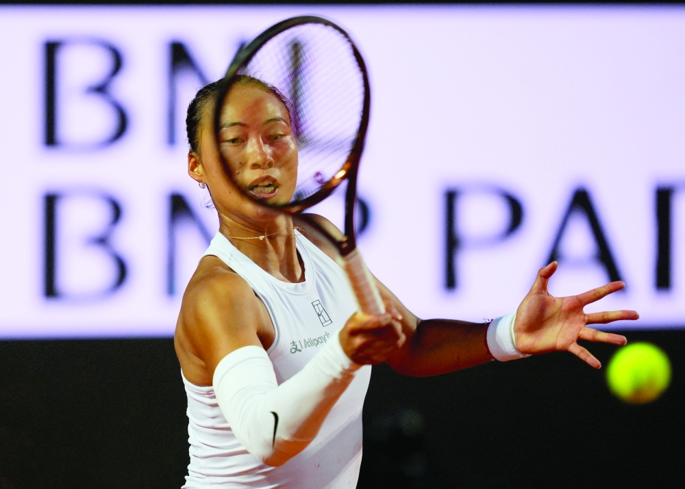 China's Qinwen Zheng in action during her quarterfinal match against Belarus' Aryna Sabalenka. — Reuters