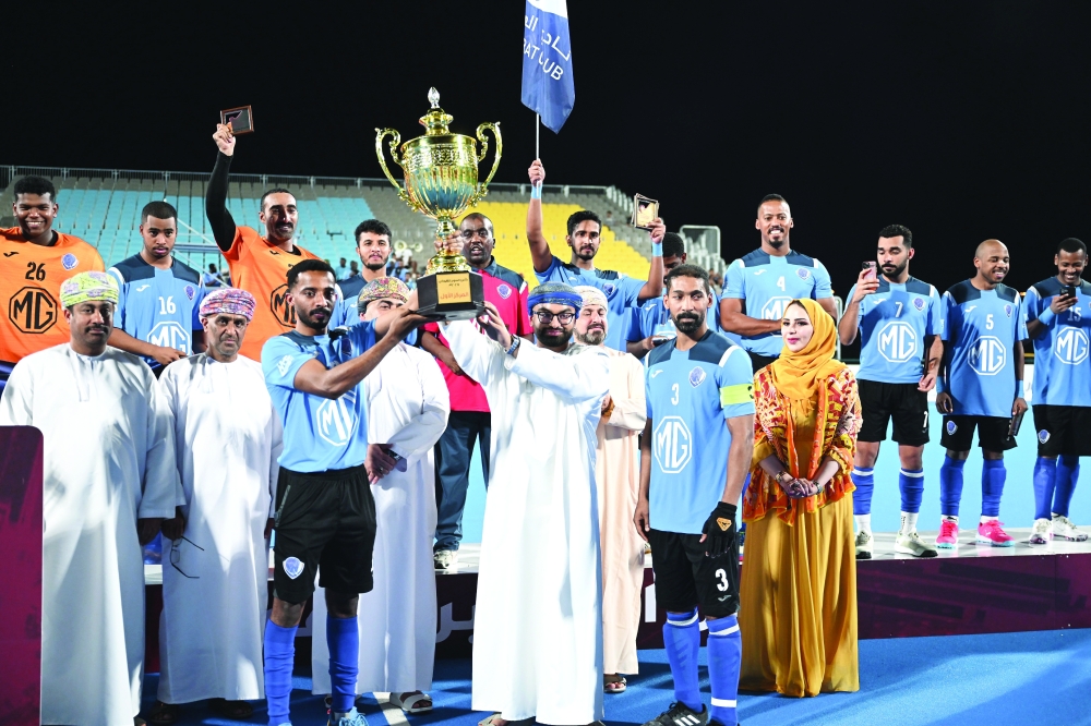 Al Amerat captain lifts the Super Cup trophy.