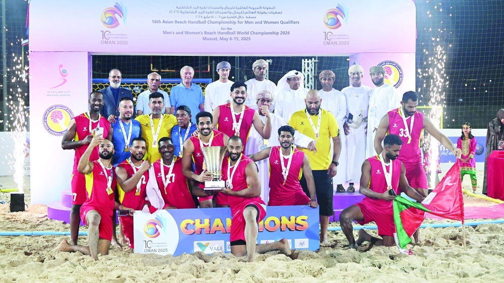 Oman players celebrate with the Asian trophy.