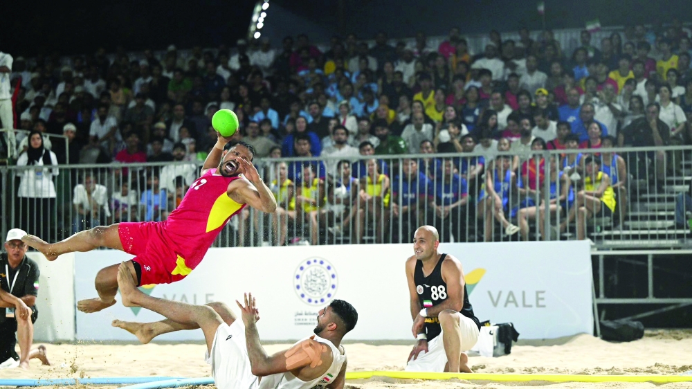 Oman player makes a goal attempt.