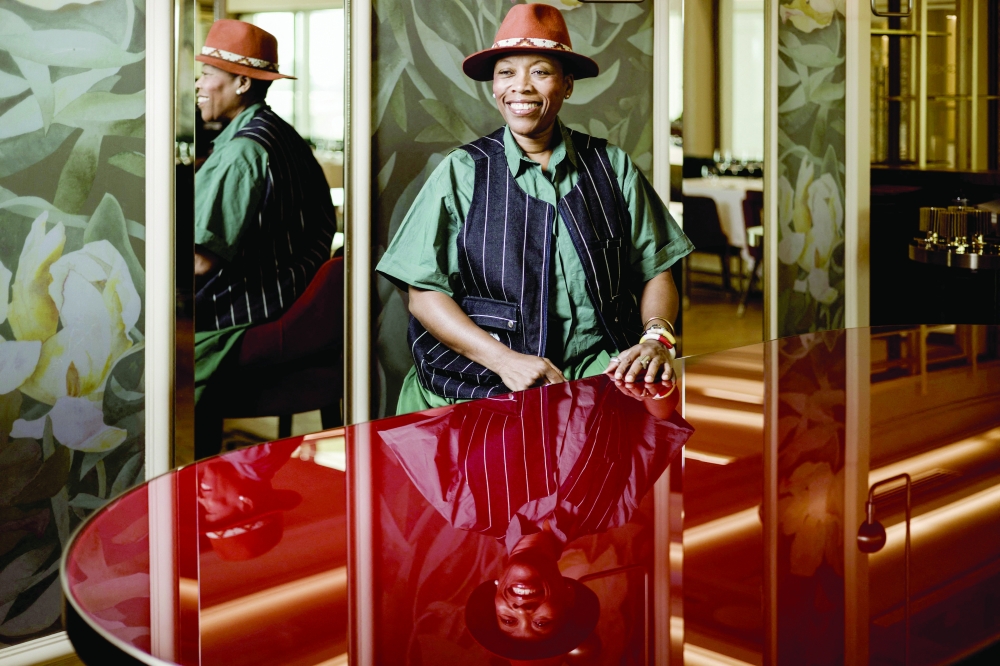 Franco Beninese Chef Georgiana Viou of the one-star Michelin Restaurant Rouge at the Margaret Hôtel Chouleur in Nimes, France, smiles as she poses for a portrait in her Restaurant L’Ami at the Sofitel Hotel in Cotonou, on January 12, 2025. 