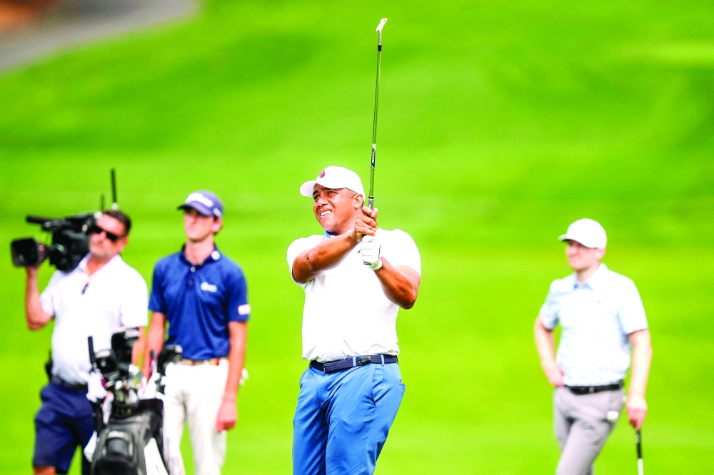 Jhonattan Vegas hits his approach shot on the fifth hole during the second round of the PGA Championship golf tournament at Quail Hollow. — Reuters