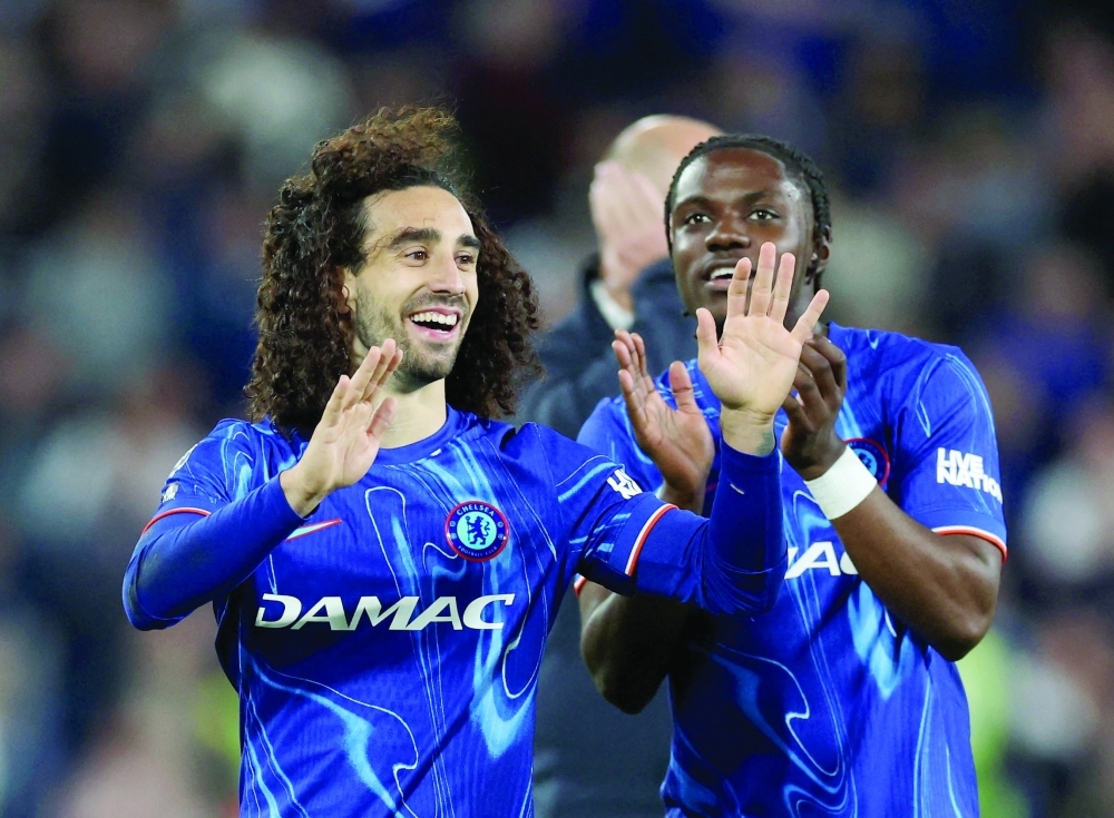 Chelsea's Marc Cucurella and Romeo Lavia celebrate after the match. — Reuters/