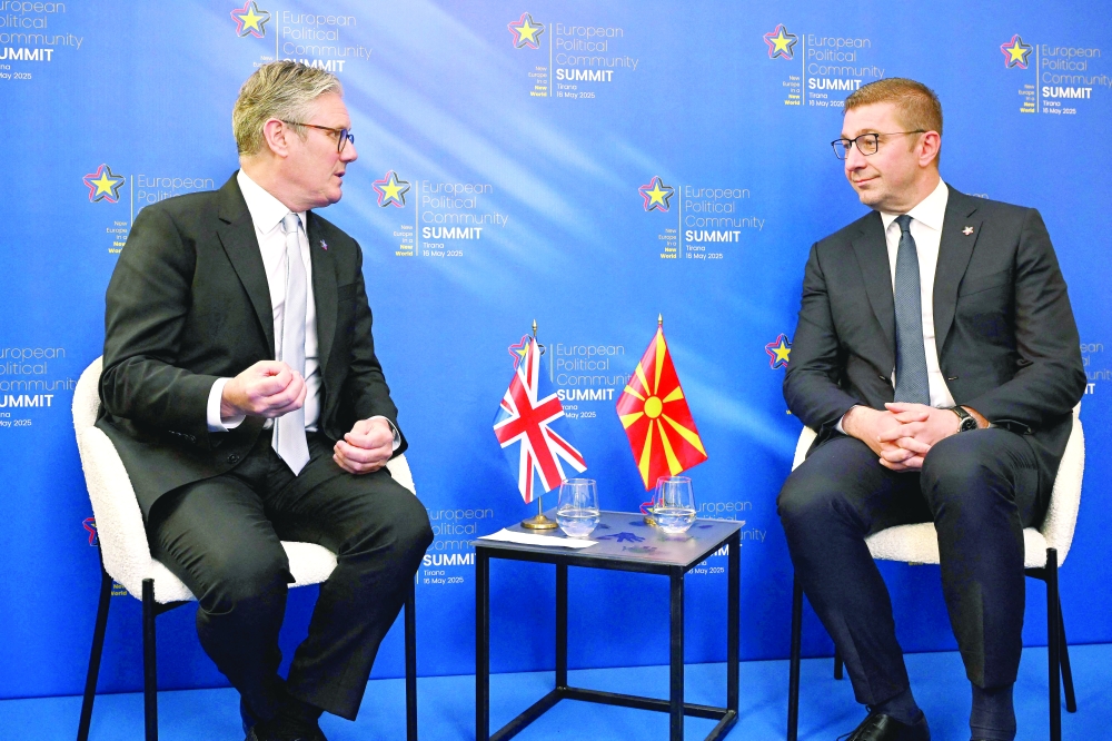 Britain's PM Keir Starmer (L) and North Macedonia's PM Hristijan Mickoski take part in a meeting, in Tirana. — AFP