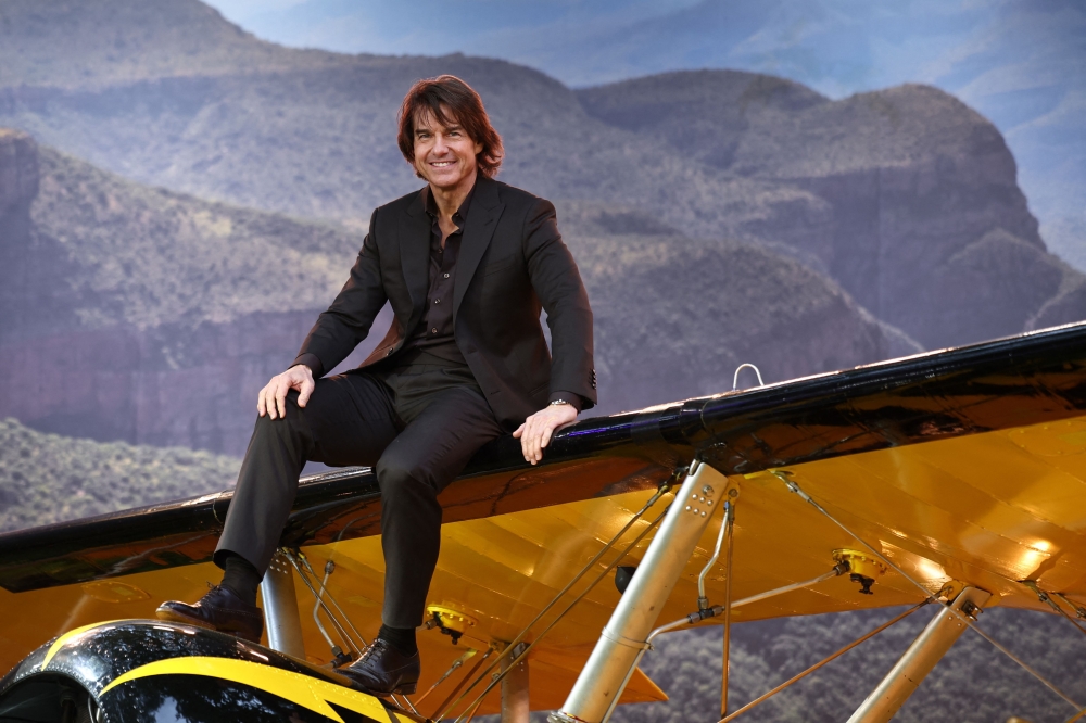 US actor Tom Cruise sits on a plane on the red carpet upon arrival for the Global Premiere of "Mission: Impossible - The Final Reckoning" at Leicester Square Gardens in central London, on May 15, 2025.  (Photo by HENRY NICHOLLS / AFP)

