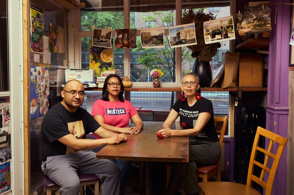 From left: Marco Saavedra, Maria Ponce Sevilla and Blanka Amezkua, organizers of the new BronxArtSpace exhibition ¡Te Amo Porque S.O.S. Pueblo!, together at a restaurant in the Bronx, May 6, 2025. (Luis Corzo/The New York Times)