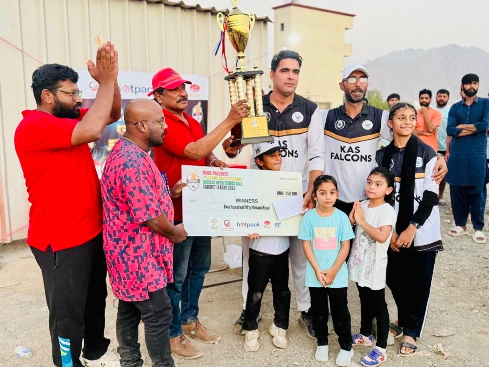 KAS Falcons receive their winners trophy.