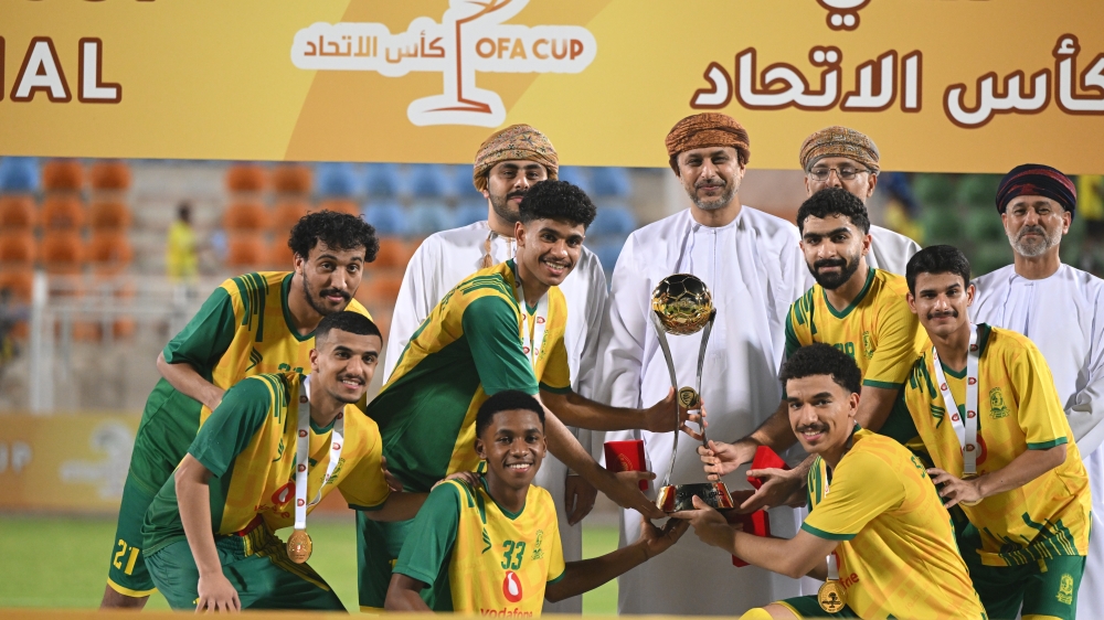 Seeb players receive the trophy. — Abdulwahid al Hamadani 