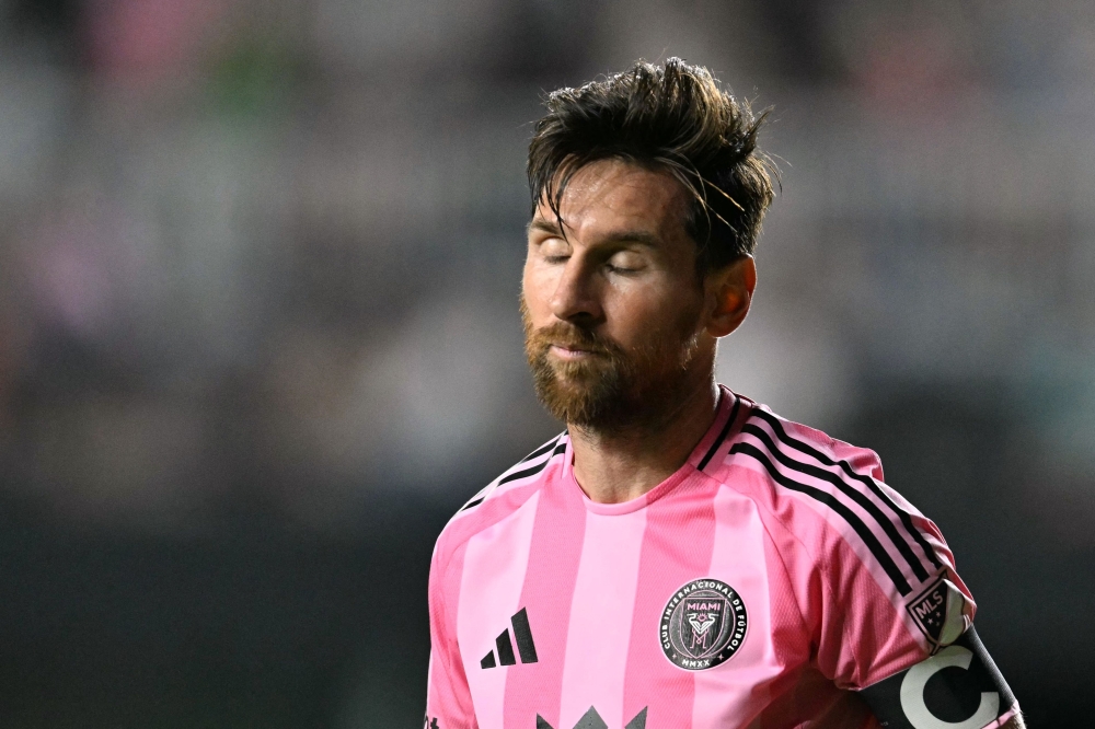 Inter Miami's Argentine forward #10 Lionel Messi reacts during the Major League Soccer match between Inter Miami CF and Orlando City SC at Chase Stadium in Fort Lauderdale, Florida, on May 18, 2025. (Photo by CHANDAN KHANNA / AFP)

