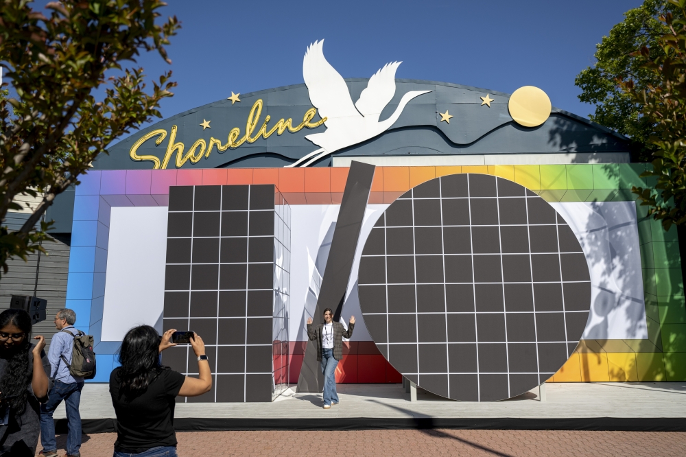Attendees take pictures with the Google I/O sign at Shoreline Amphitheatre during Google I/O, an annual conference for software developers, in Mountain View, Calif., on Tuesday, May 20, 2025. (Mike Kai Chen/The New York Times)