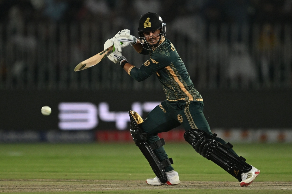 Peshawar Zalmi's Saim Ayub plays a shot during the Pakistan Super League (PSL) Twenty20 cricket match between Karachi Kings and Peshawar Zalmi at the Rawalpindi Cricket Stadium in Rawalpindi on May 17, 2025.      (Photo by Farooq NAEEM / AFP)

