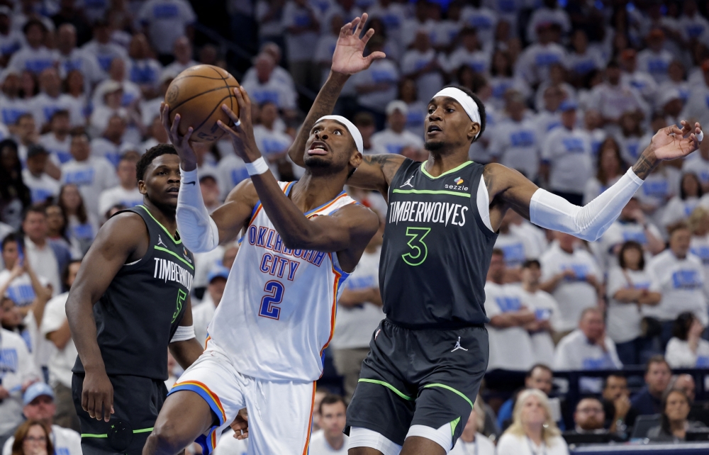 Oklahoma City Thunder guard Shai Gilgeous-Alexander (2) drives against Minnesota Timberwolves forward Jaden McDaniels (3) in the fourth quarter during game one of the western conference finals for the 2025 NBA Playoffs at Paycom Center. — Reuters 