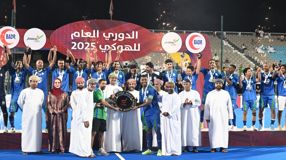Ahli Sidab players celebrate with the OHL Shield.