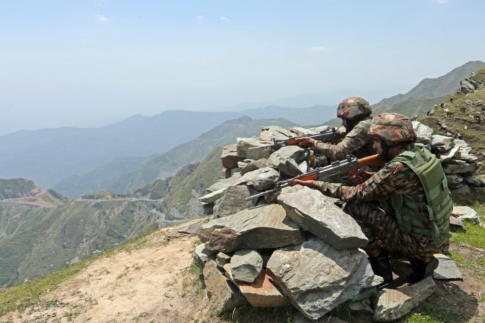Indian army soldiers keep vigil near the Line of Control (LoC) between Pakistan and India, in Jammu region. — AFP