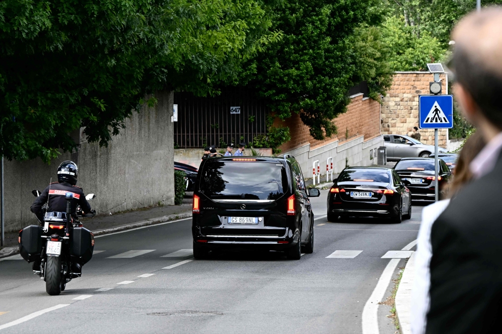 Vehicles of delegations leave the Omani embassy after a fifth round of nuclear talks between Iran and the United States, in Rome on Friday. - AFP
