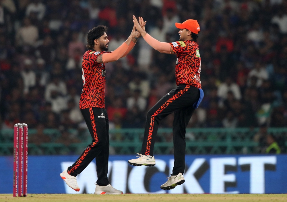 Sunrisers Hyderabad's Nitish Kumar Reddy celebrates with Abhishek Sharma after taking the wicket of Royal Challengers Bengaluru's Mayank Agarwal caught out by Sunrisers Hyderabad's Ishan Kishan. — Reuters