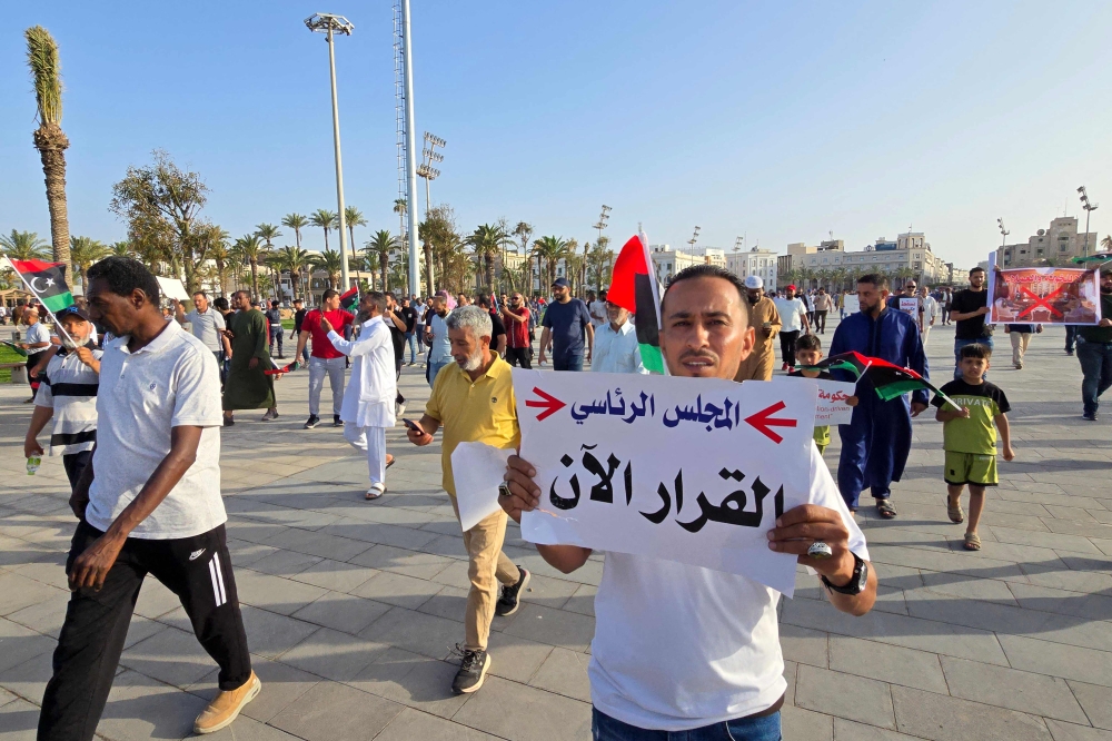 Demonstrators gather, at the Martyrs' Square in Libya's capital Tripoli. — AFP