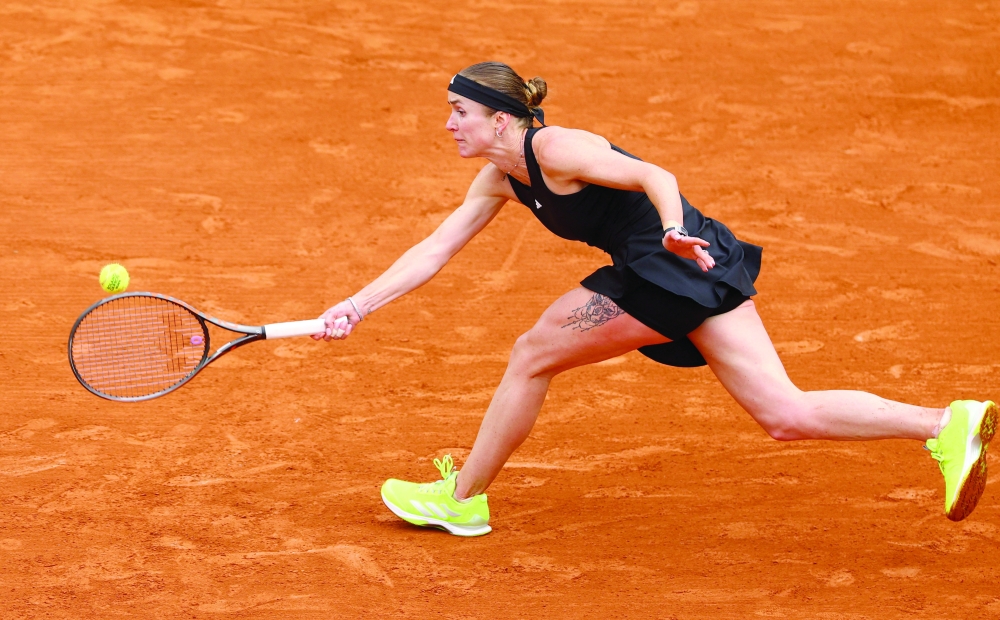 Ukraine's Elina Svitolina in action during her first round match against Turkey's Zeynep Sonmez. — Reuters