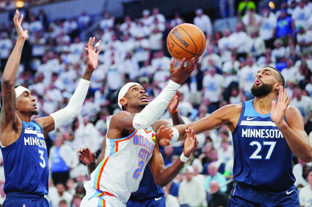 Oklahoma City Thunder guard Shai Gilgeous-Alexander (2) shoots the ball over Minnesota Timberwolves centre Rudy Gobert (27) during the first half in game three of the western conference finals for the 2025 NBA Playoffs at Target Center. — Reuters
