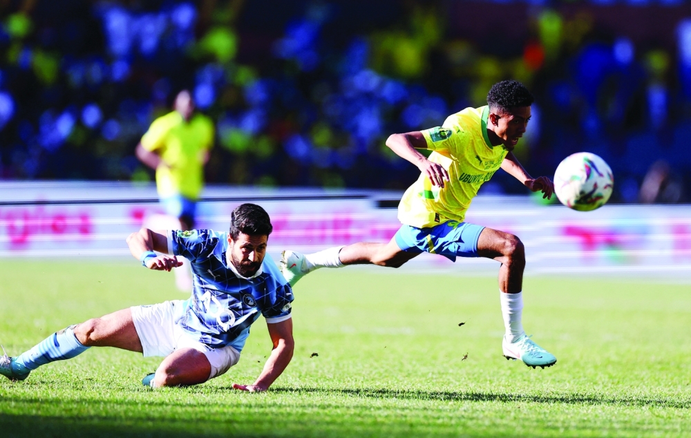 Pyramids' Ahmed Samy in action with Mamelodi Sundowns' Tashreeq Matthews. — Reuters