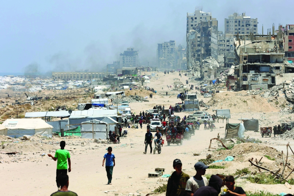 Palestinians transport their belongings as they flee the northern Gaza Strip towards the south. — AFP