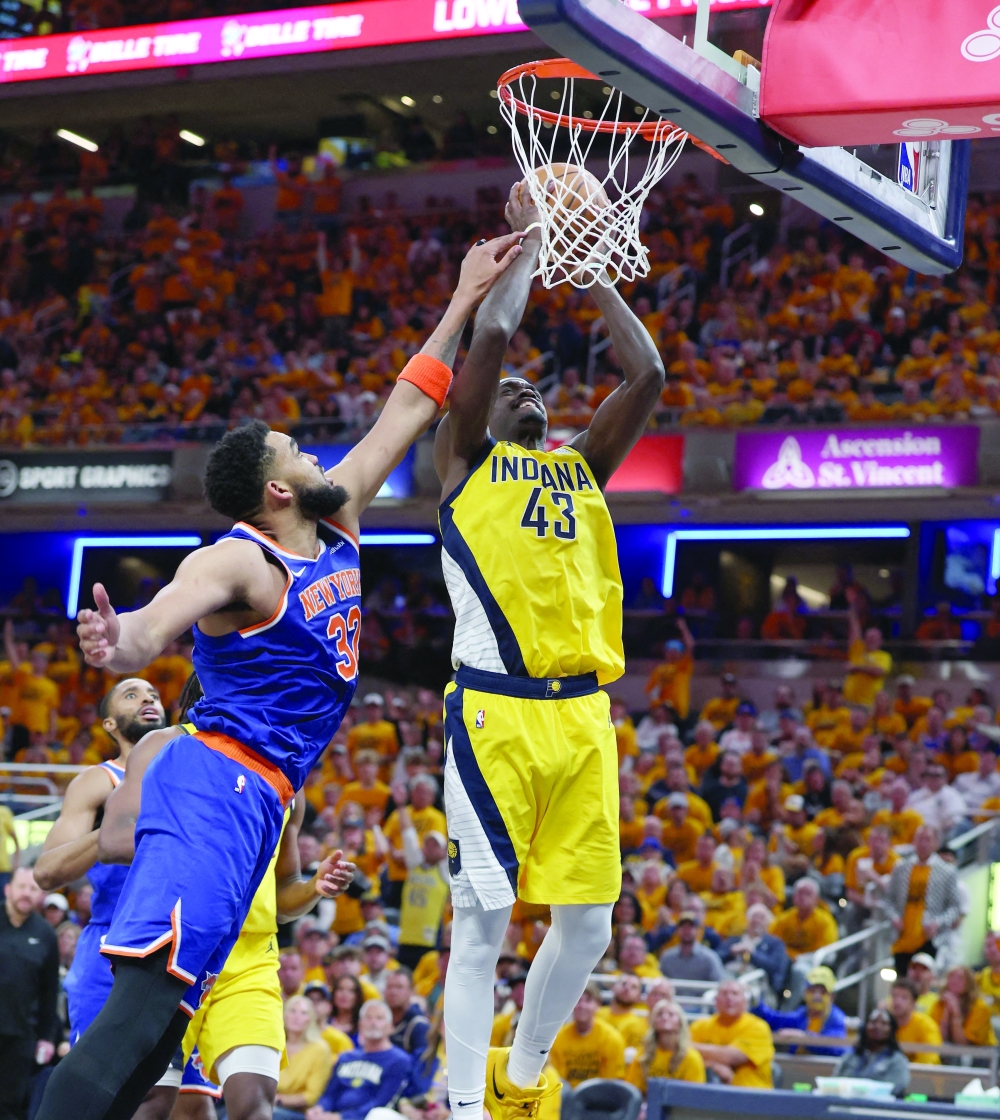 Indiana Pacers forward Pascal Siakam (43) drives to the hoop past New York Knicks center Karl-Anthony Towns (32) during the third quarter of game three of the eastern conference finals for the 2025 NBA Playoffs at Gainbridge Fieldhouse. — Reuters