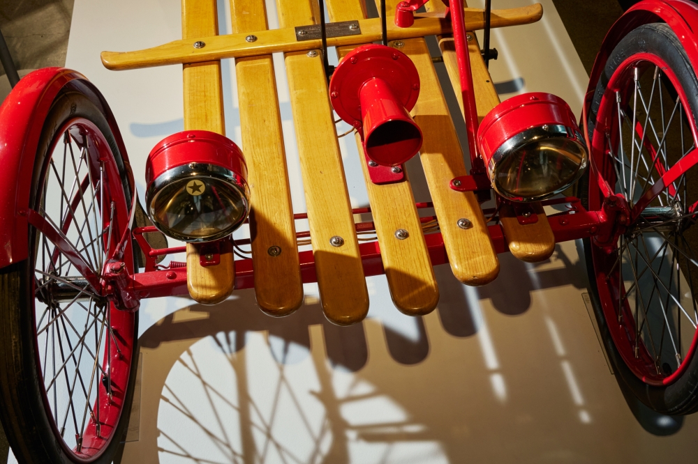 The front of a 1928 Auto Red Bug, an open-air two-seated electric vehicle manufactured by the Automotive Electric Service Corporation, in the exhibit “Alternating Currents: The Fall and Rise of Electric Vehicles,” at the Petersen Automotive Museum in Los Angeles, April 29, 2025. (Maggie Shannon/The New York Times)